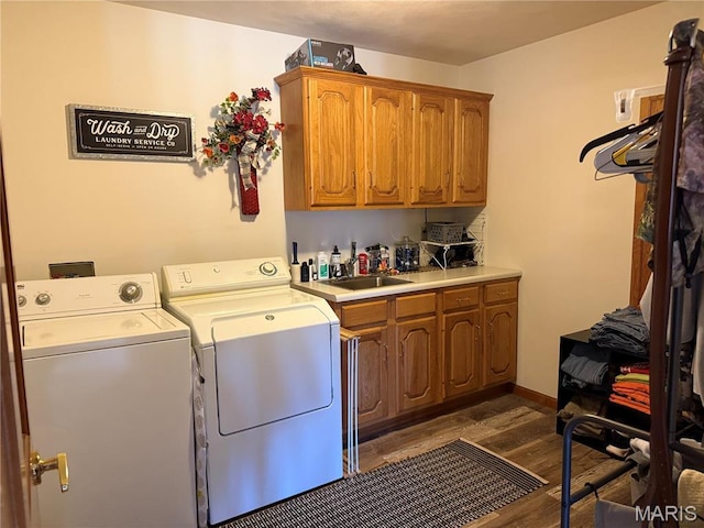 clothes washing area featuring cabinet space, independent washer and dryer, and dark wood-style floors