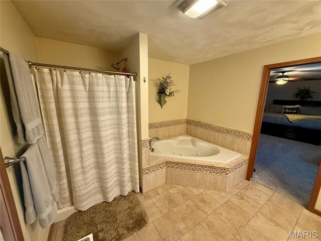 full bath featuring a whirlpool tub, ceiling fan, and curtained shower