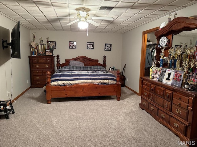 bedroom with light carpet, baseboards, and ceiling fan