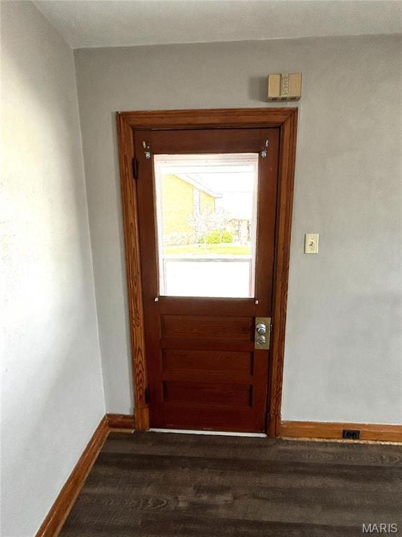 102 E 1st St, Waterloo, IL 62298 - entryway with baseboards and dark wood-style flooring