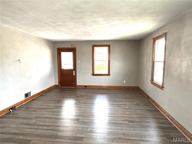 102 E 1st St, Waterloo, IL 62298 - unfurnished room featuring wood finished floors, baseboards, and a textured ceiling