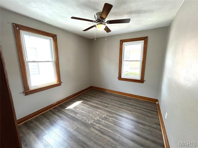 102 E 1st St, Waterloo, IL 62298 - unfurnished room with plenty of natural light, baseboards, and wood finished floors