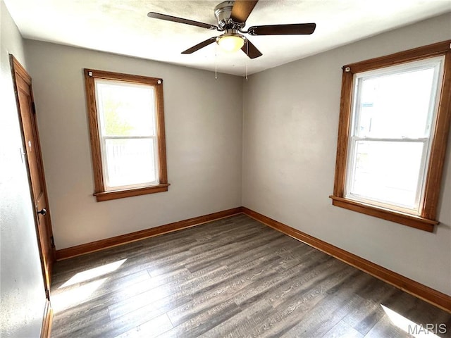 102 E 1st St, Waterloo, IL 62298 - unfurnished room featuring wood finished floors, baseboards, and a ceiling fan