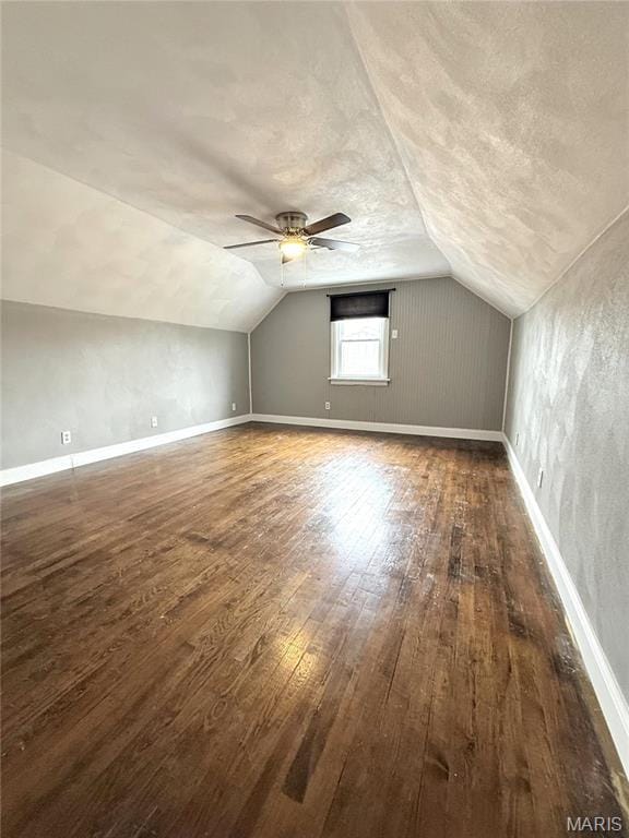 102 E 1st St, Waterloo, IL 62298 - bonus room featuring vaulted ceiling, hardwood / wood-style floors, ceiling fan, a textured ceiling, and baseboards