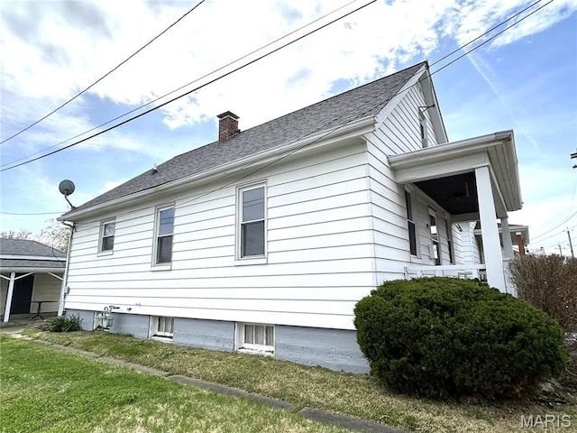 102 E 1st St, Waterloo, IL 62298 - view of side of home with a chimney and a yard