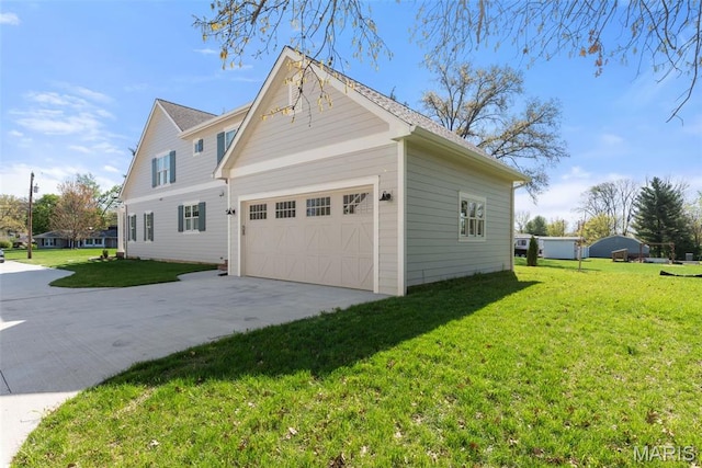9870 E Concord Rd, Saint Louis, MO 63128 - view of property exterior featuring concrete driveway, a lawn, and an attached garage