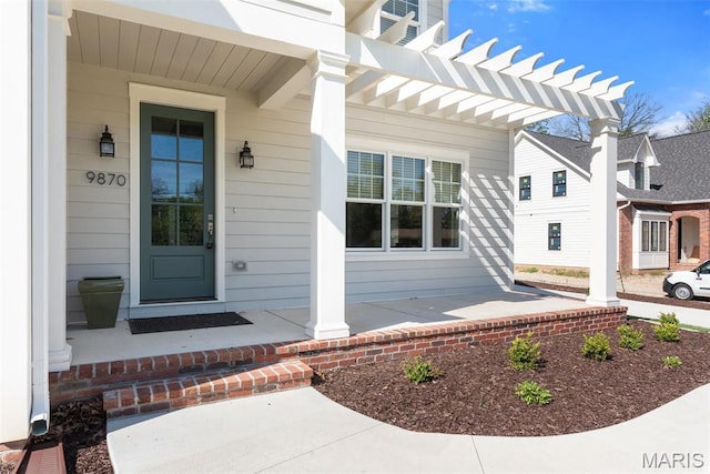 9870 E Concord Rd, Saint Louis, MO 63128 - property entrance with a porch and a pergola
