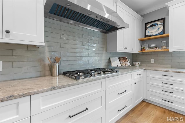 9870 E Concord Rd, Saint Louis, MO 63128 - kitchen with wall chimney exhaust hood, stainless steel gas stovetop, crown molding, decorative backsplash, and open shelves