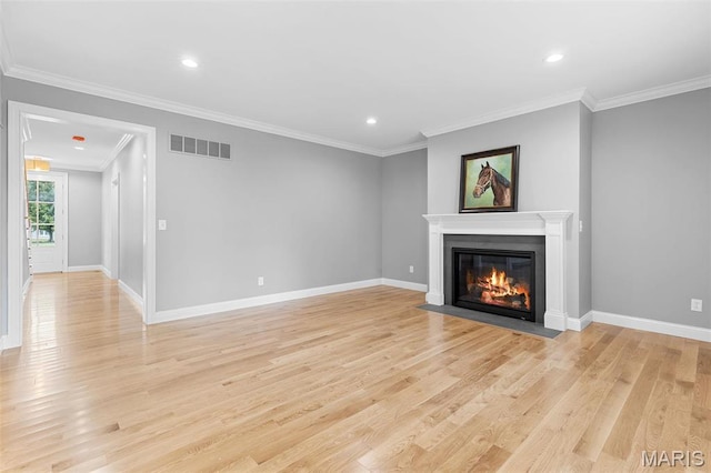 9870 E Concord Rd, Saint Louis, MO 63128 - unfurnished living room featuring a fireplace with flush hearth, light wood-type flooring, crown molding, recessed lighting, and baseboards