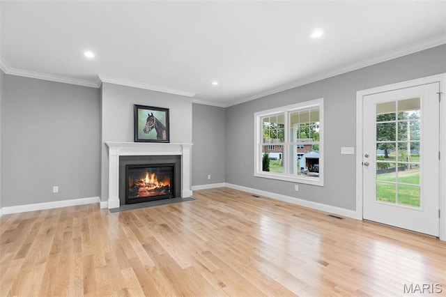 9870 E Concord Rd, Saint Louis, MO 63128 - unfurnished living room featuring a fireplace with flush hearth, light wood-type flooring, crown molding, recessed lighting, and baseboards