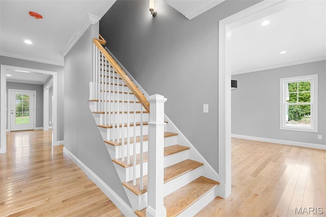 9870 E Concord Rd, Saint Louis, MO 63128 - stairs featuring crown molding, wood finished floors, baseboards, and recessed lighting