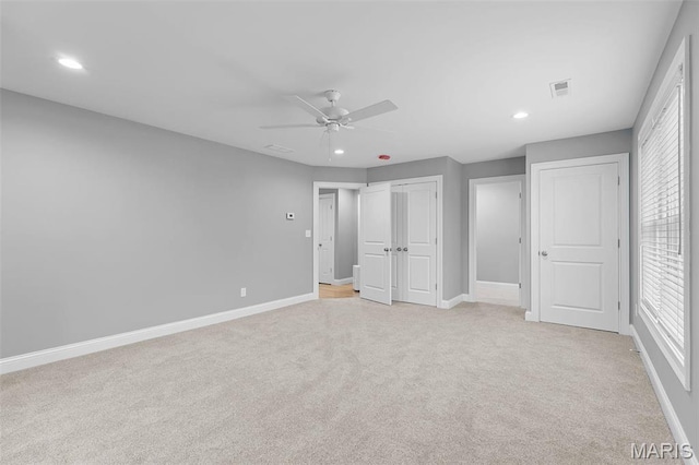 9870 E Concord Rd, Saint Louis, MO 63128 - unfurnished bedroom with light carpet, baseboards, recessed lighting, and ceiling fan