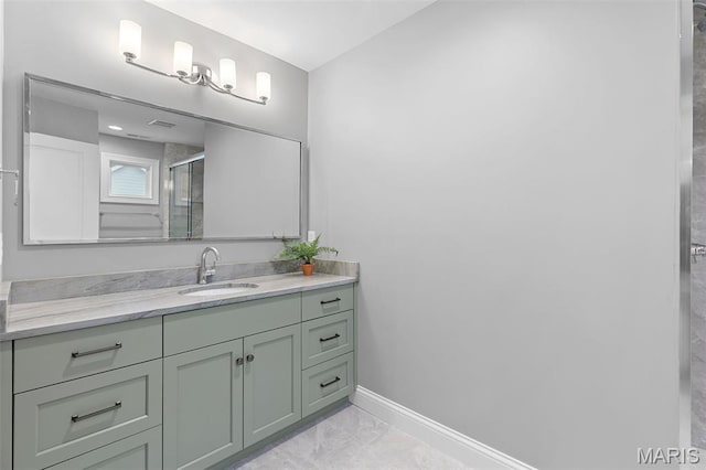 9870 E Concord Rd, Saint Louis, MO 63128 - full bath featuring marble look tile flooring, baseboards, a shower stall, and vanity