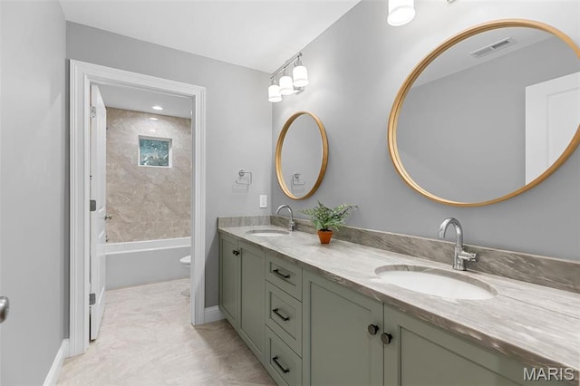 9870 E Concord Rd, Saint Louis, MO 63128 - bathroom featuring double vanity, bathtub / shower combination, toilet, and baseboards