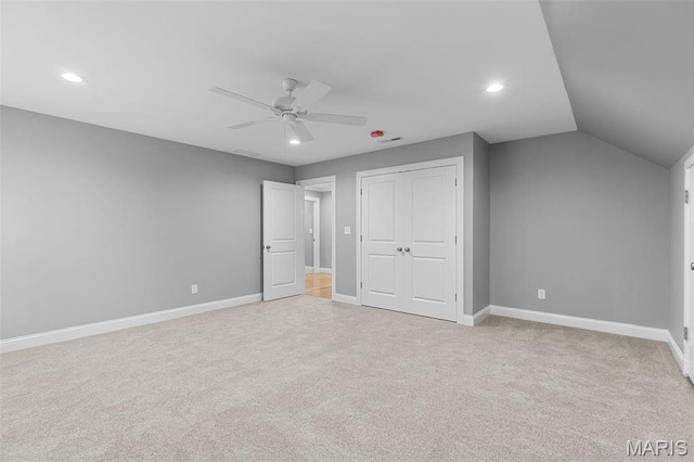 9870 E Concord Rd, Saint Louis, MO 63128 - unfurnished bedroom featuring recessed lighting, light colored carpet, baseboards, a closet, and vaulted ceiling