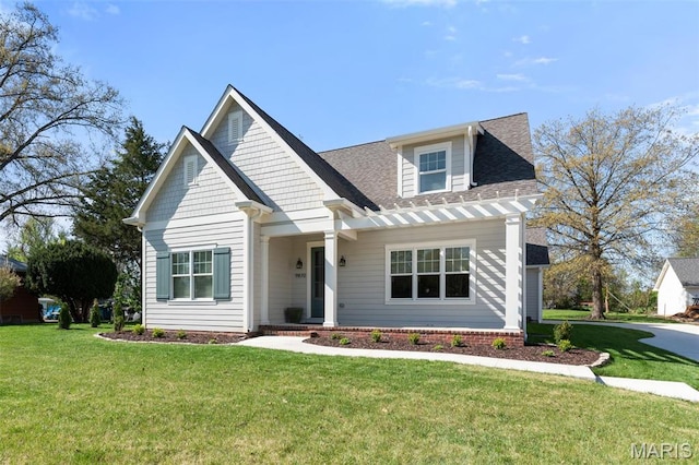 9870 E Concord Rd, Saint Louis, MO 63128 - view of front of home featuring a front lawn and roof with shingles