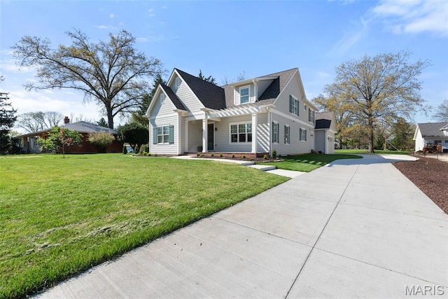 9870 E Concord Rd, Saint Louis, MO 63128 - view of front of home featuring concrete driveway, a front lawn, and a shingled roof