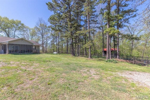 view of yard with a sunroom