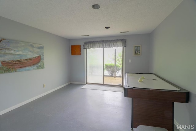 1207 Napoleon Dr, Bonne Terre, MO 63628 - recreation room featuring a textured ceiling and finished concrete flooring