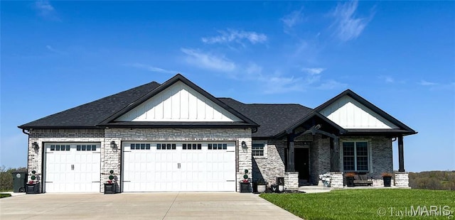 303 Orange Bowl Dr, Cape Girardeau, MO 63701 - view of front of home featuring board and batten siding, an attached garage, concrete driveway, and a front yard