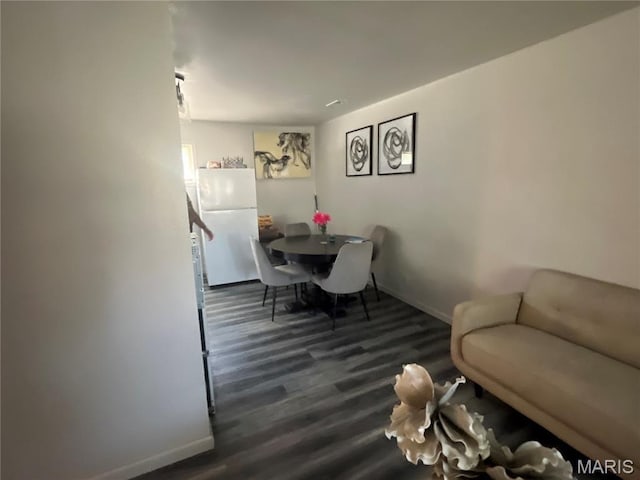 102 W Adams Dr, Cahokia, IL 62206 - dining space featuring dark wood-type flooring