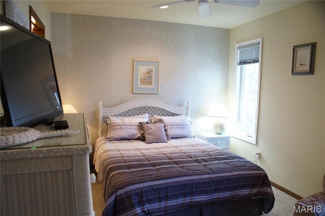 64 W Windjammer Ct Unit 2D, Lake Ozark, MO 65049 - carpeted bedroom featuring baseboards and a ceiling fan