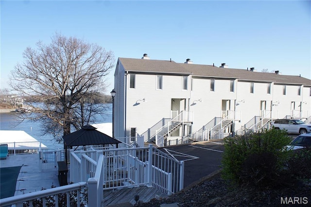 64 W Windjammer Ct Unit 2D, Lake Ozark, MO 65049 - view of property featuring fence and stairway