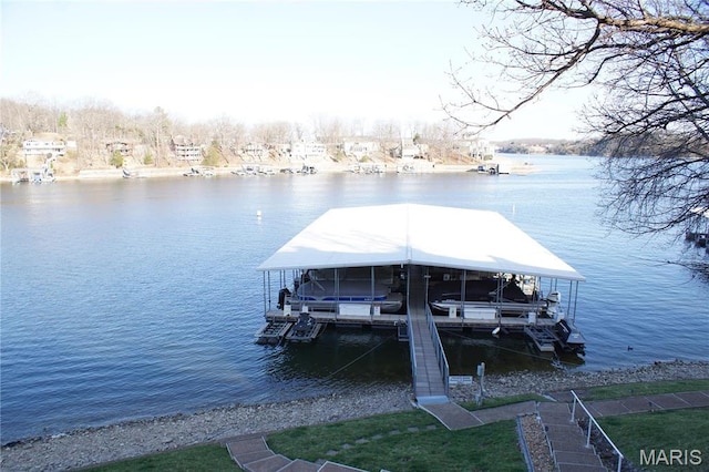 64 W Windjammer Ct Unit 2D, Lake Ozark, MO 65049 - dock with boat lift and a water view