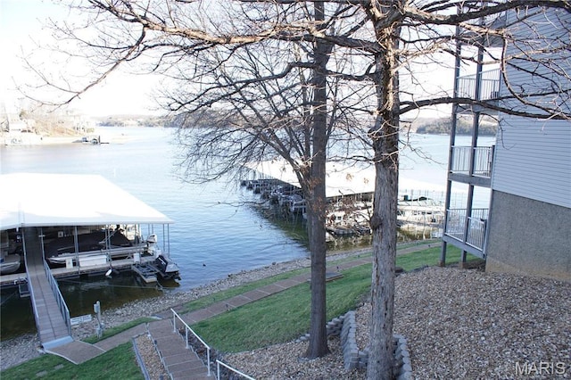 64 W Windjammer Ct Unit 2D, Lake Ozark, MO 65049 - dock area featuring a water view, boat lift, and a yard