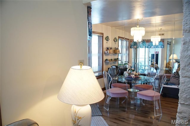 64 W Windjammer Ct Unit 2D, Lake Ozark, MO 65049 - dining room featuring a chandelier and wood finished floors