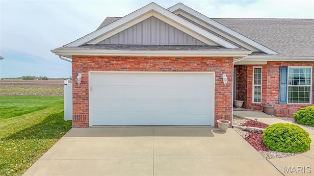 190 Bay Meadow Cir, Moro, IL 62067 - view of front facade featuring brick siding, concrete driveway, roof with shingles, and a front lawn