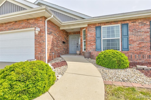 190 Bay Meadow Cir, Moro, IL 62067 - entrance to property featuring board and batten siding, a garage, and brick siding