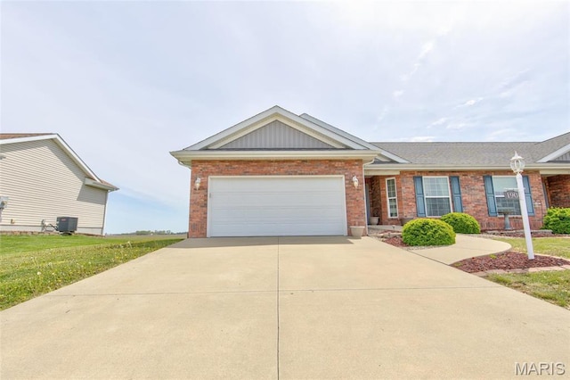 190 Bay Meadow Cir, Moro, IL 62067 - view of front of home with brick siding, cooling unit, and driveway