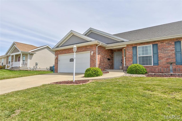 190 Bay Meadow Cir, Moro, IL 62067 - view of front of home featuring brick siding, an attached garage, driveway, board and batten siding, and a front lawn