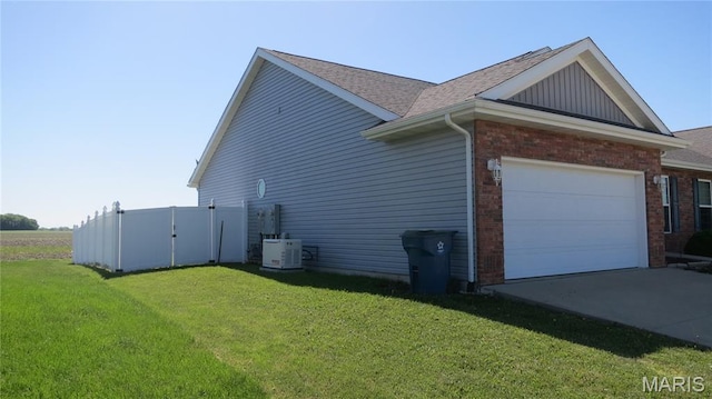 190 Bay Meadow Cir, Moro, IL 62067 - view of home's exterior featuring a yard, brick siding, driveway, and an attached garage