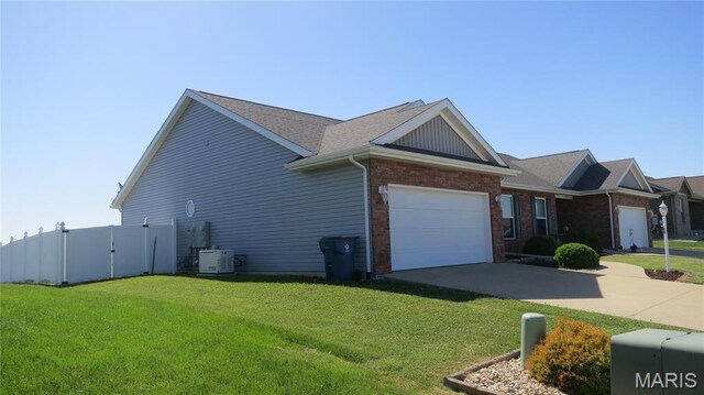 190 Bay Meadow Cir, Moro, IL 62067 - view of property exterior featuring a garage, concrete driveway, brick siding, and roof with shingles