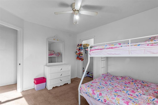 bedroom with carpet floors, a ceiling fan, and baseboards