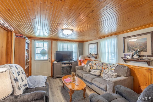 712 Nickey St, Poplar Bluff, MO 63901 - living room featuring light wood-style floors, crown molding, wood ceiling, and wood walls