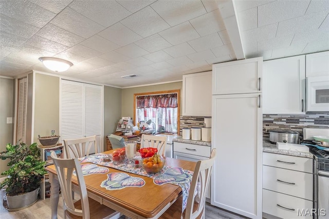 712 Nickey St, Poplar Bluff, MO 63901 - dining room with wood finished floors