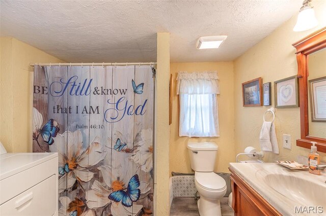 712 Nickey St, Poplar Bluff, MO 63901 - full bathroom with vanity, washer / clothes dryer, toilet, a textured ceiling, and a shower with curtain