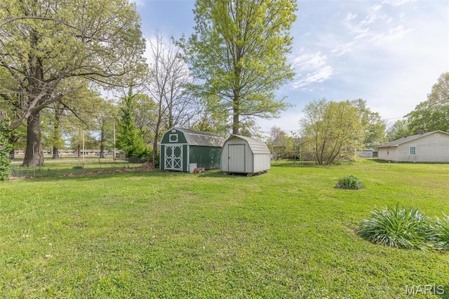 712 Nickey St, Poplar Bluff, MO 63901 - view of yard with a storage unit and an outbuilding