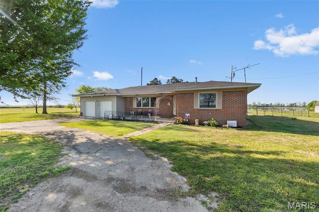 12572 Rd 516, Senath, MO 63876 - view of front of property with an attached garage, asphalt driveway, and brick siding