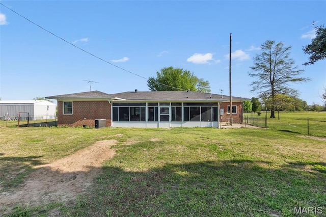 12572 Rd 516, Senath, MO 63876 - back of house featuring a sunroom, brick siding, and cooling unit