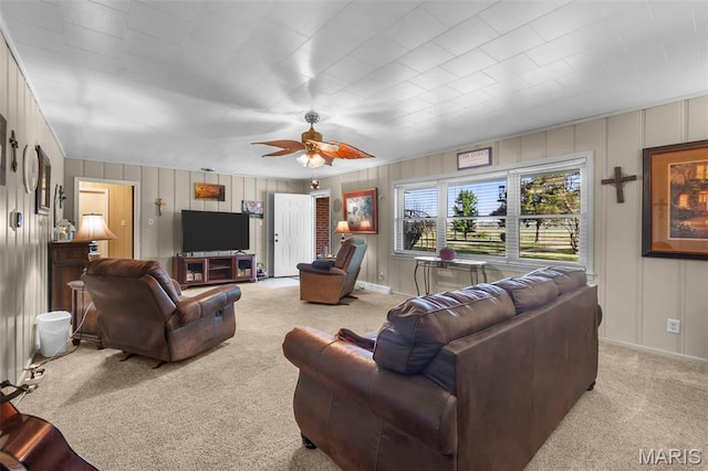 12572 Rd 516, Senath, MO 63876 - living area with light carpet, ceiling fan, baseboards, and a decorative wall