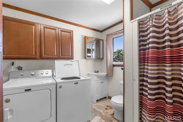 12572 Rd 516, Senath, MO 63876 - laundry area with washing machine and dryer and crown molding
