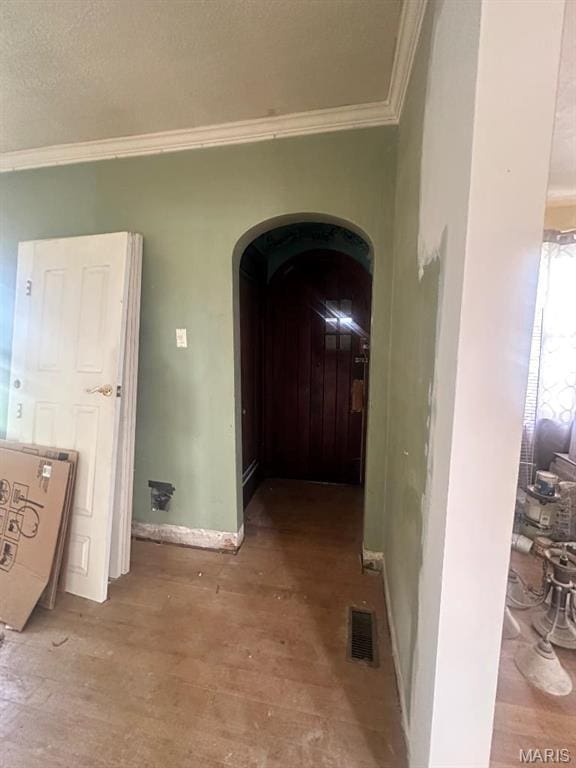 713 S Rapp Ave, Columbia, IL 62236 - hall with ornamental molding, wood-type flooring, arched walkways, and baseboards