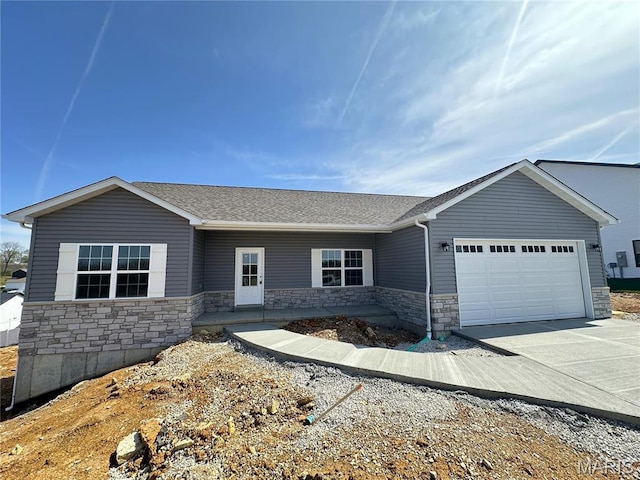 208 Pacific Ave, Union, MO 63084 - ranch-style house with stone siding, a garage, a shingled roof, and driveway