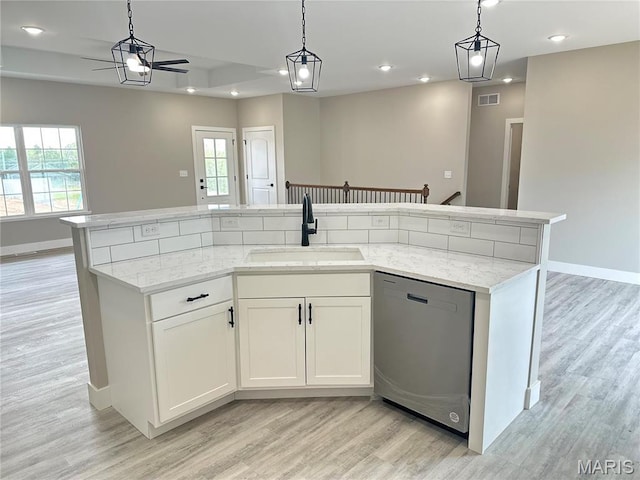 208 Pacific Ave, Union, MO 63084 - kitchen featuring dishwasher, a sink, open floor plan, a ceiling fan, and recessed lighting