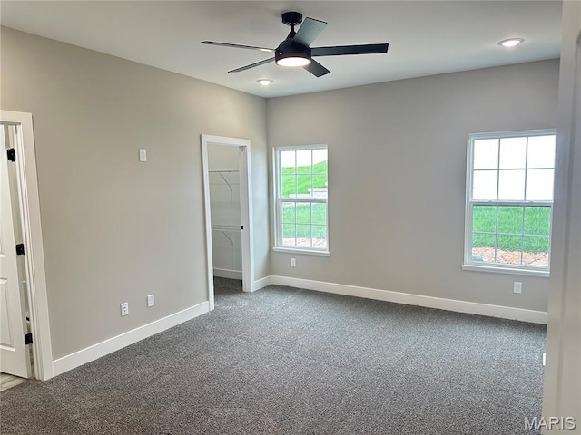208 Pacific Ave, Union, MO 63084 - unfurnished bedroom featuring baseboards, carpet floors, a spacious closet, and ceiling fan