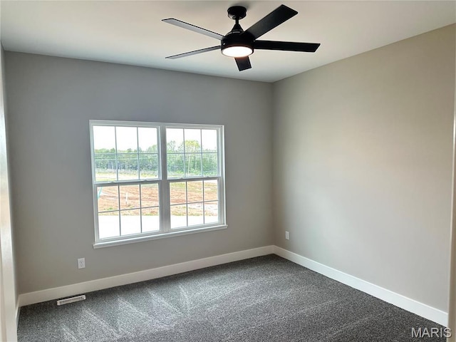 208 Pacific Ave, Union, MO 63084 - empty room with baseboards, dark carpet, and ceiling fan